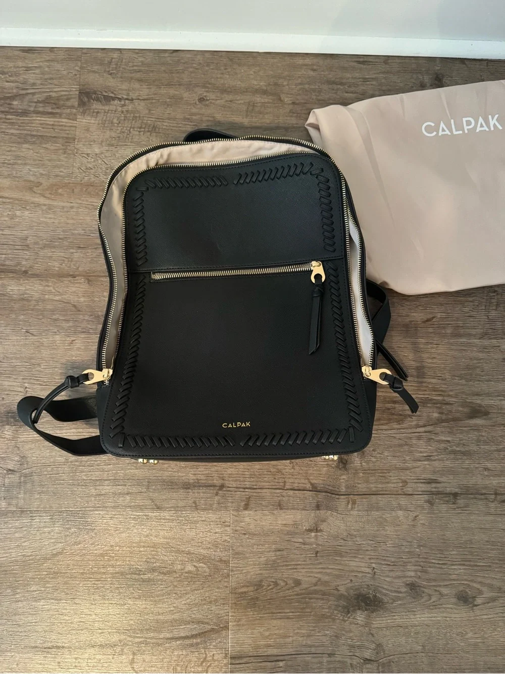 Calpak Black Backpack with Woven Trim and Gold Hardware
